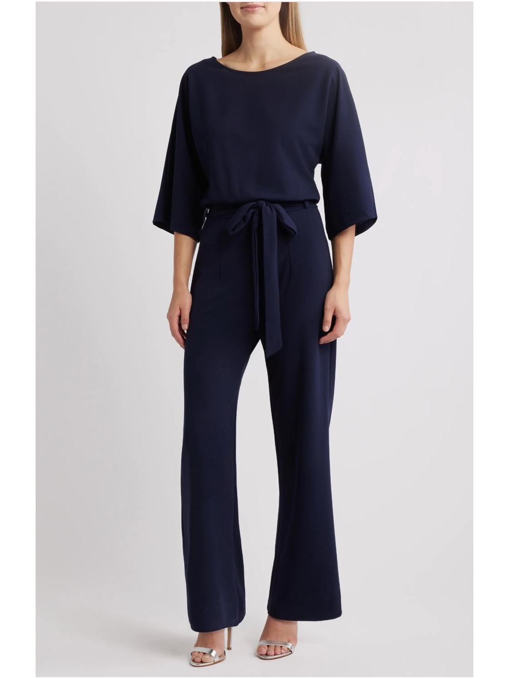21. Nikki Lund • $235 US Belted Navy Wide-Sleeve Jumpsuit PTP 22” +